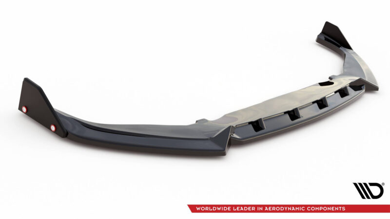 Dark gray automotive diffuser with multiple fins, shown on a white background; branding logo visible in the bottom right corner.