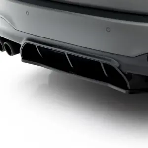 Close-up of a car's rear bumper showing dual exhaust pipes with a sleek chrome finish on a white background