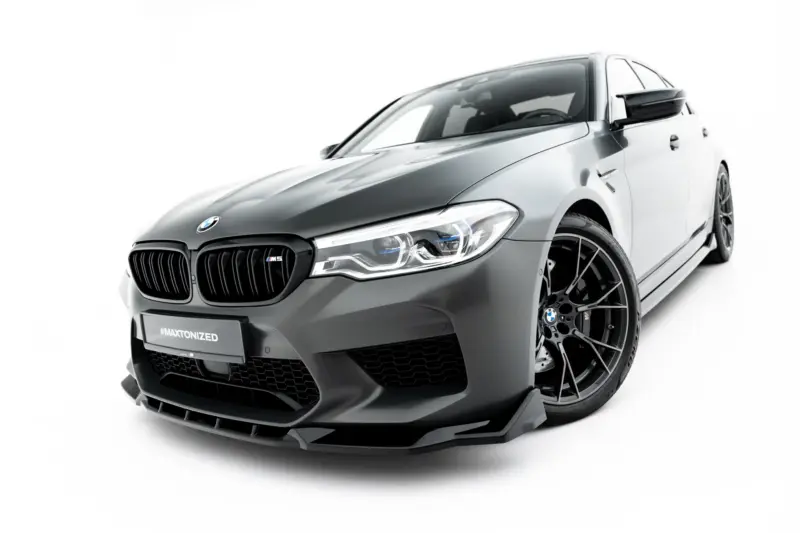 pol_po_Set-of-Splitters-V-2-BMW-M5-F90-23926_10webp - OPSHOLDERS Front-left view of a silver BMW M5 sports sedan against a white background, highlighting the bold kidney grille and sharp headlights.