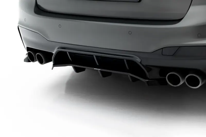 pol_po_Set-of-Splitters-V-2-BMW-M5-F90-23926_2webp - OPSHOLDERS Rear view of a gray sports car showing quad exhaust outlets and a subtle diffuser with a Maxton Design badge