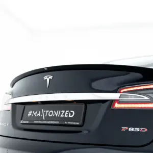 Rear view of a dark Tesla Model S with the Tesla logo, chrome trim, and red taillights visible; a license-area reads #MAXTONIZED