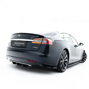Rear three-quarter view of a dark gray Tesla Model S with red taillights and 'P85D' badge, on a white studio background with a black license plate area reading '#MALTONIZED' (promo image).