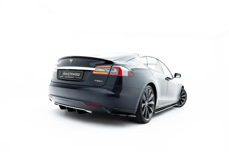 Rear three-quarter view of a dark gray Tesla Model S with red taillights and 'P85D' badge, on a white studio background with a black license plate area reading '#MALTONIZED' (promo image).