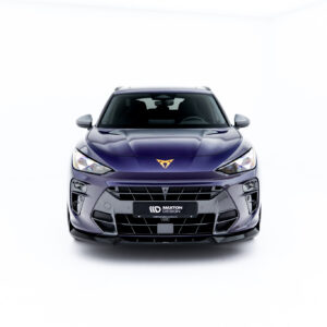 Front view of a metallic purple car in a bright studio, facing the camera, showing the grille, headlights, and a MAXTON DESIGN license plate badge.