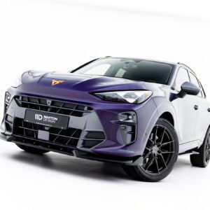 Front-left view of a glossy purple SUV with an aggressive front bumper and large alloy wheels against a white studio background.