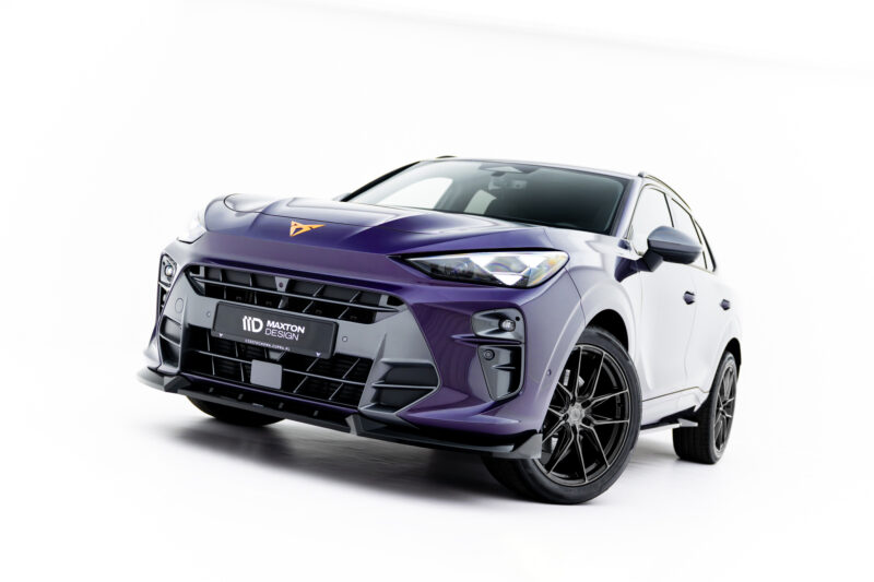 Front-left view of a glossy purple SUV with an aggressive front bumper and large alloy wheels against a white studio background.