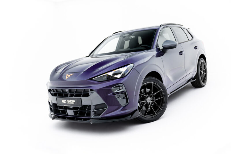 Front-left angled view of a purple SUV with a bold front grille and large black alloy wheels, set against a white background.