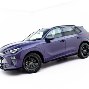 Front-left three-quarter view of a purple SUV with black alloy wheels against a white studio backdrop.