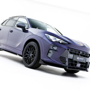 Purple SUV angled to the left against a white studio backdrop, showcasing stylish alloy wheels and sporty front end on display.