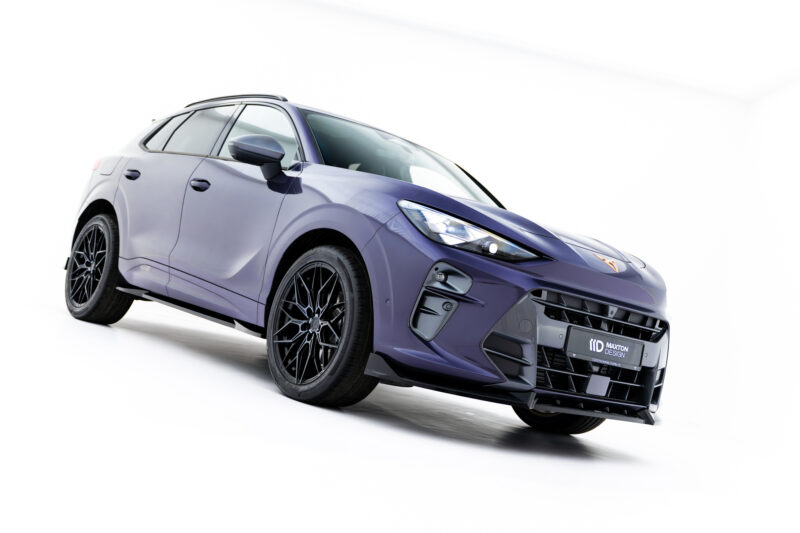 Purple SUV angled to the left against a white studio backdrop, showcasing stylish alloy wheels and sporty front end on display.