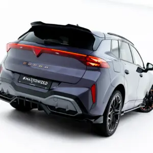 Rear three-quarter view of a dark gray CUPRA SUV with illuminated taillight on a white studio background.