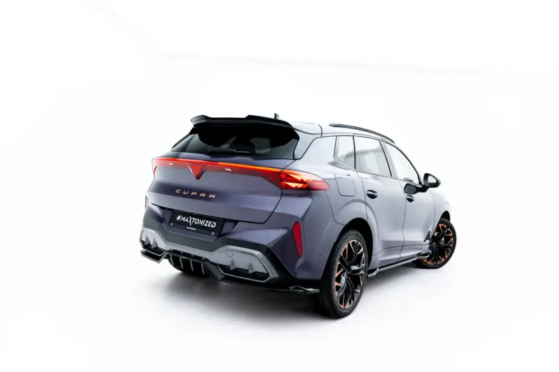 Rear three-quarter view of a gray CUPRA SUV with red taillights, shown against a white backdrop.