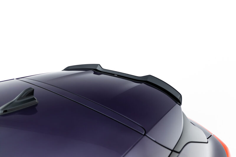 Close-up of a dark purple car roof with a low-profile rear spoiler along the rear edge.
