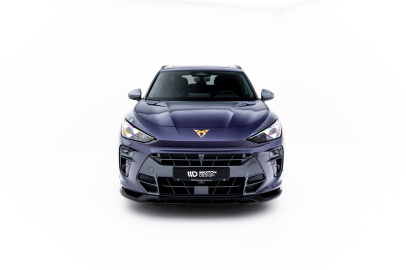 Front view of a dark purple car facing the camera, showing its grille, headlights, and prominent bumper detail with a Maxton Design license plate area.