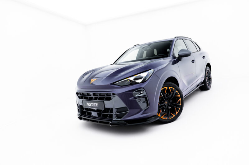 Front three-quarter view of a purple sports SUV with orange accents and large black wheels against a white studio background