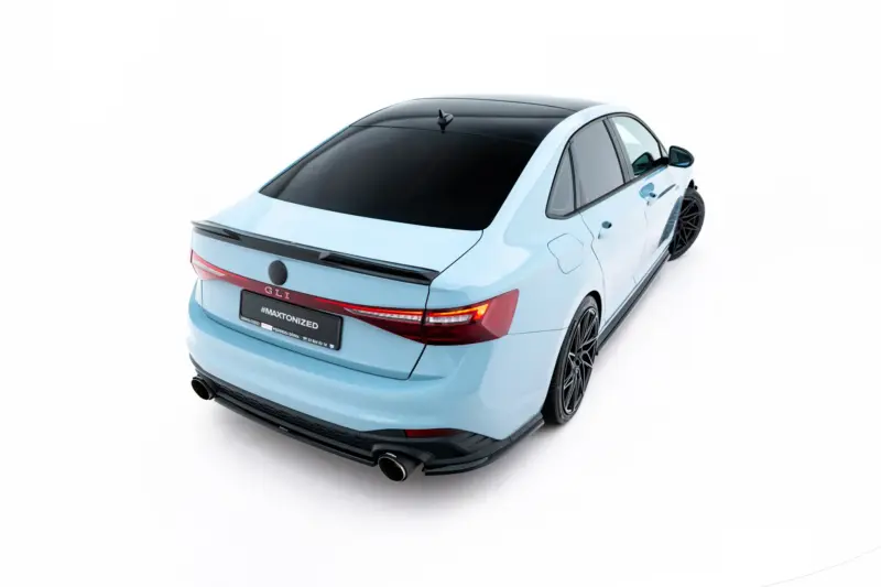 Rear-left view of a light blue sedan with a black panoramic roof and large black alloy wheels, on a white background.