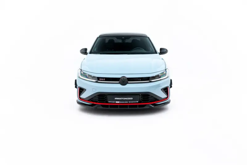 Front view of a light blue car facing the camera with a black grille and red accents along the bumper labeled '#MAXTONIZED'.