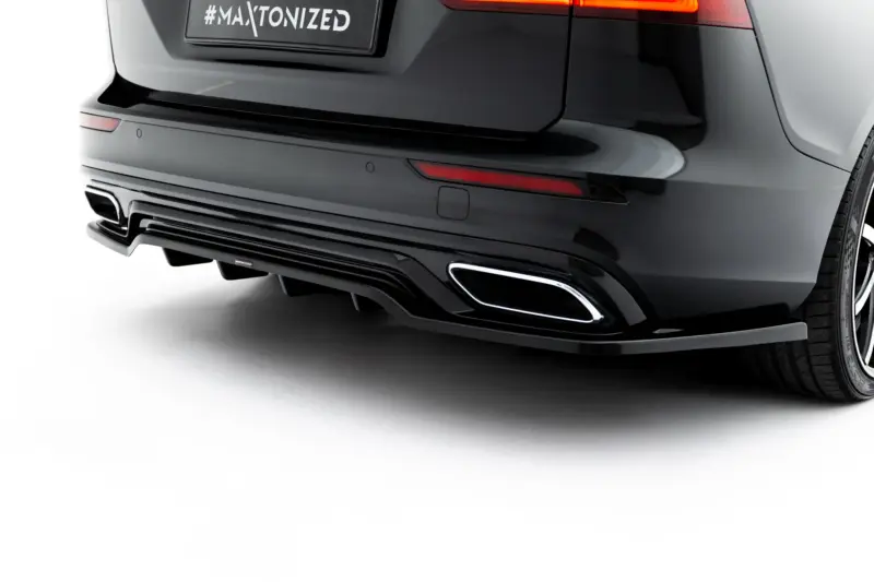 pol_po_Set-of-Splitters-Volvo-V60-R-Design-Mk3-23996_11webp - OPSHOLDERS Close-up of the rear of a dark SUV, showing a red taillight, sleek bumper, exhaust, and a plate that reads '#MAYTONIZED'.