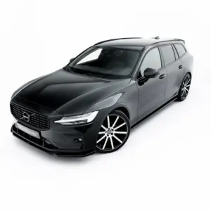 Gray Volvo station wagon photographed in a white studio background, angled from the front-left showing the grille and wheels.