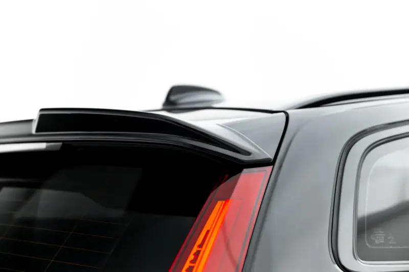 pol_po_Set-of-Splitters-Volvo-V60-R-Design-Mk3-23996_8webp - OPSHOLDERS Close-up of the rear end of a silver SUV, showing the rear window, red tail light strip, and roofline spoiler.