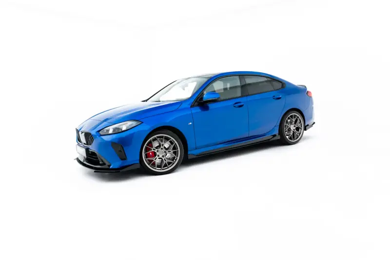pol_po_Side-Flaps-BMW-2-M235i-Gran-Coupe-M-Pack-F74-23844_2webp - OPSHOLDERS Blue BMW M4 sports car photographed from a low front-left angle against a white background with visible alloy wheels and red brake calipers.