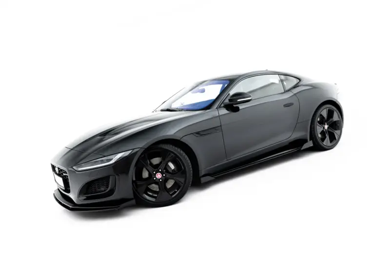 Grey Jaguar sports car photographed from the front-left quarter, set against a white background.