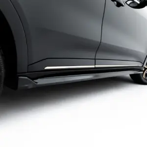 Close-up of a gray car's side panel with a large alloy wheel visible at the rear, against a white background