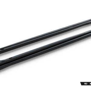 Pair of black windshield wiper blades laid diagonally on a white background, with a Maxton Design watermark bottom right.