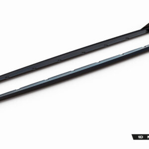 Two long black car side skirts with mounting tabs, shown diagonally on a white background (Maxton Design product).