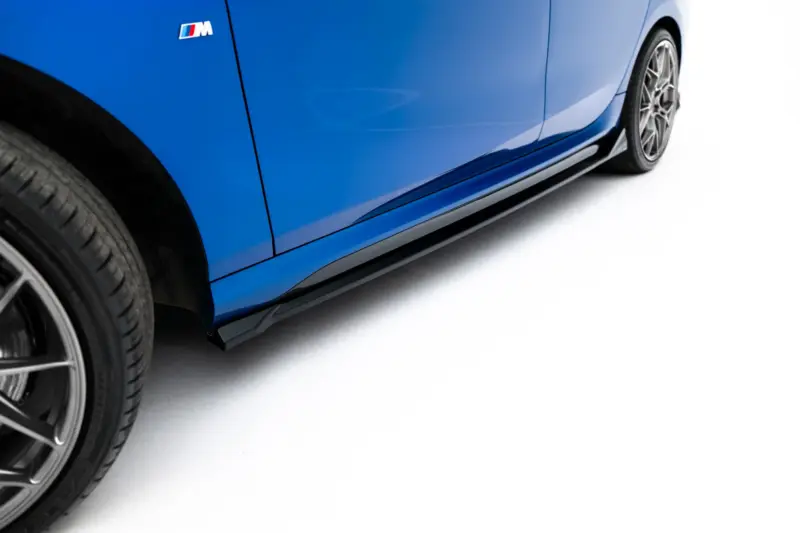 pol_po_Side-Skirts-Diffusers-BMW-2-M235i-Gran-Coupe-M-Pack-F74-23854_4webp - OPSHOLDERS Blue car side panel with BMW M badge and alloy wheel visible on left, white backdrop