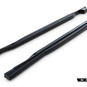 Pair of black roof rack crossbars laid diagonally on a white background, with Maxton Design branding visible at the bottom right.