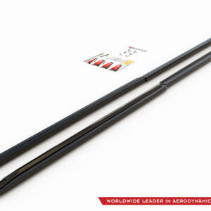Two black windshield wiper blades on a white background with a small product brochure nearby and a company logo in the corner.