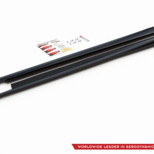 Diagonal view of two dark windshield wiper blades with a small instruction card and screws on a white background; brand logo visible bottom-right corner.