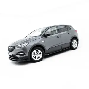 Gray compact SUV shown in a front-three-quarter view on a white background, highlighting its headlights and wheels.