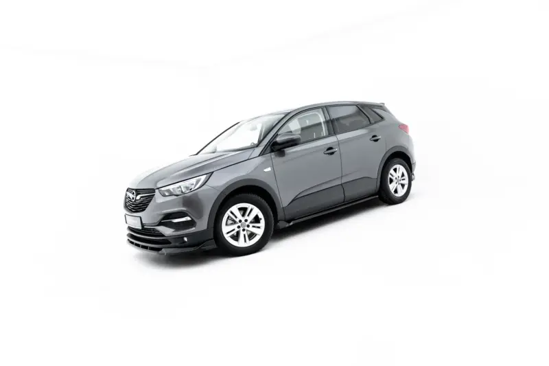Gray compact SUV shown in a front-three-quarter view on a white background, highlighting its headlights and wheels.