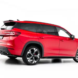 Red Škoda SUV shown from the rear-left side with a spoiler and large alloy wheels on a white background.