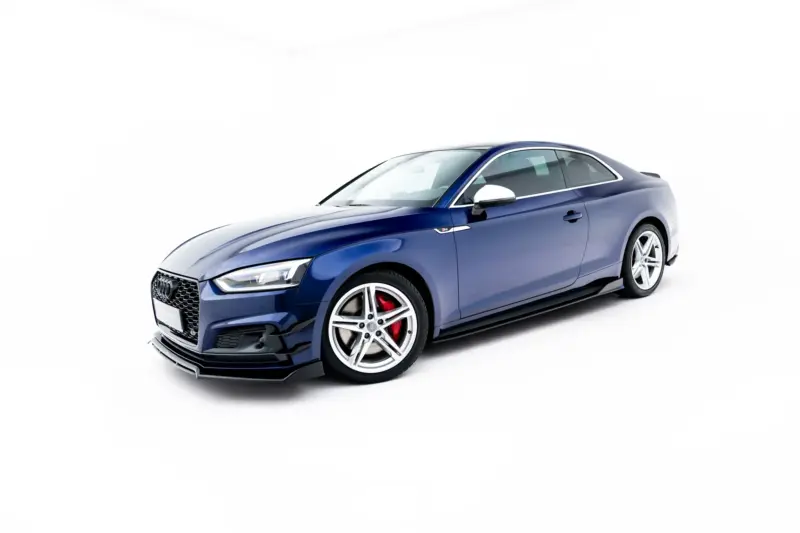 Blue Audi S5 coupe, angled from the front-left showing grille, headlight, and large wheels on a white background.
