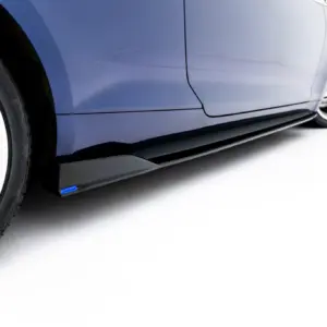 Close-up of a blue car's side panel and wheel, showing a silver alloy wheel with a red brake caliper behind it