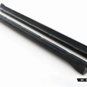 Two dark angular car side skirts laid diagonally on a white background with Maxton Design branding at the bottom right.