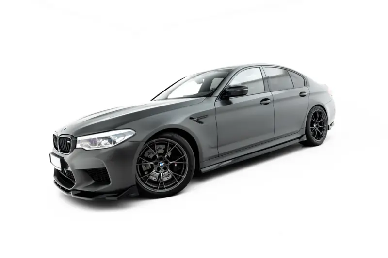 pol_po_Side-Skirts-Diffusers-V-2-BMW-M5-F90-23921_1webp - OPSHOLDERS Gray luxury sports sedan photographed from a low front-left angle, highlighting its aggressive bumper and large black alloy wheels