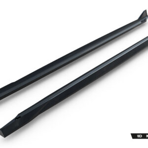 Two black roof rack crossbars on a white background, angled diagonally, with Maxton Design branding in the bottom-right corner.