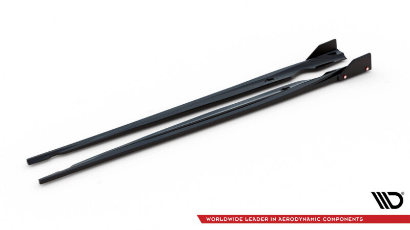 Two dark gray aerodynamic windshield wiper blades laid diagonally on a white background, with the brand logo and red slogan ribbon visible in the bottom-right corner.