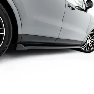 Close-up of a gray Porsche car's side panel and front wheel with a large black-and-white multi-spoke rim.