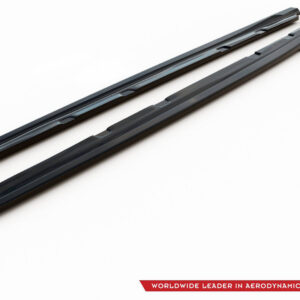 Two black aerodynamic roof bars viewed diagonally across a white background, with a logo and red banner in the corner indicating the product line.