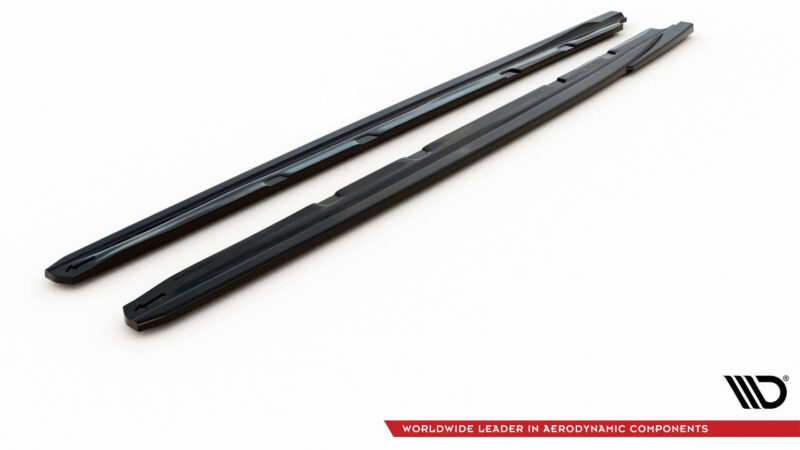 Two black aerodynamic roof bars viewed diagonally across a white background, with a logo and red banner in the corner indicating the product line.