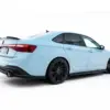 pol_po_Side-Skirts-Diffusers-Volkswagen-Jetta-GLI-Mk7-Facelift-2-23933_5webp - OPSHOLDERS Rear-left three-quarter view of a pale blue sports car with a spoiler, dark wheels, and red tail lights.