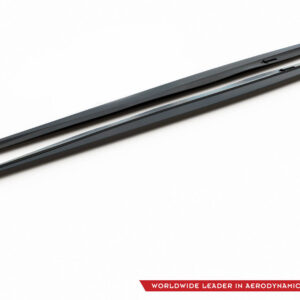 Two black aerodynamic roof crossbars lying diagonally on a white background, with brand logo in the bottom-right corner.