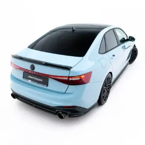 Rear three-quarter view of a light blue sedan with a black roof, large dark alloy wheels, and a license plate reading #MAXTONIZED.