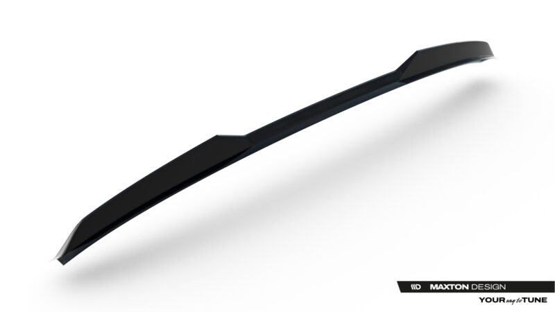 Close-up of a glossy black automotive aero part, diagonally oriented on a white background, with Maxton Design branding visible in the bottom corner.