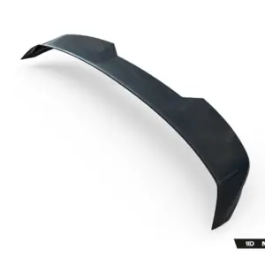Close-up of a glossy, dark curved strip bending across a white background, with Maxton Design branding visible in the lower-right corner.